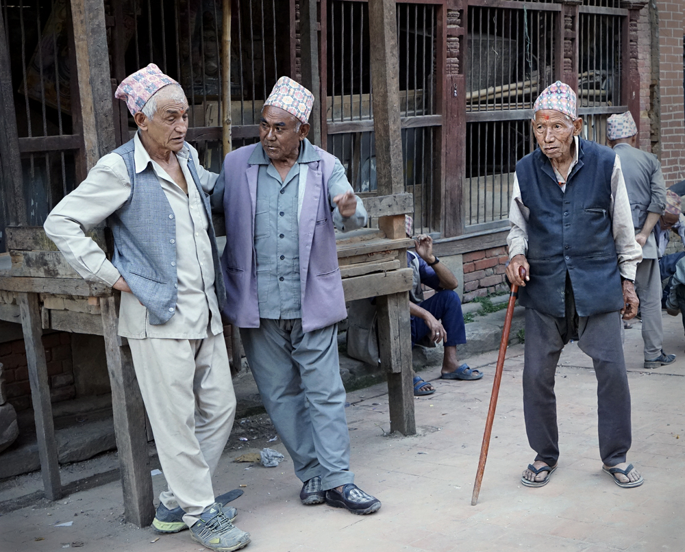 Street photography, Nepalese men, hat, walking stick, Bhaktapur, Nepal