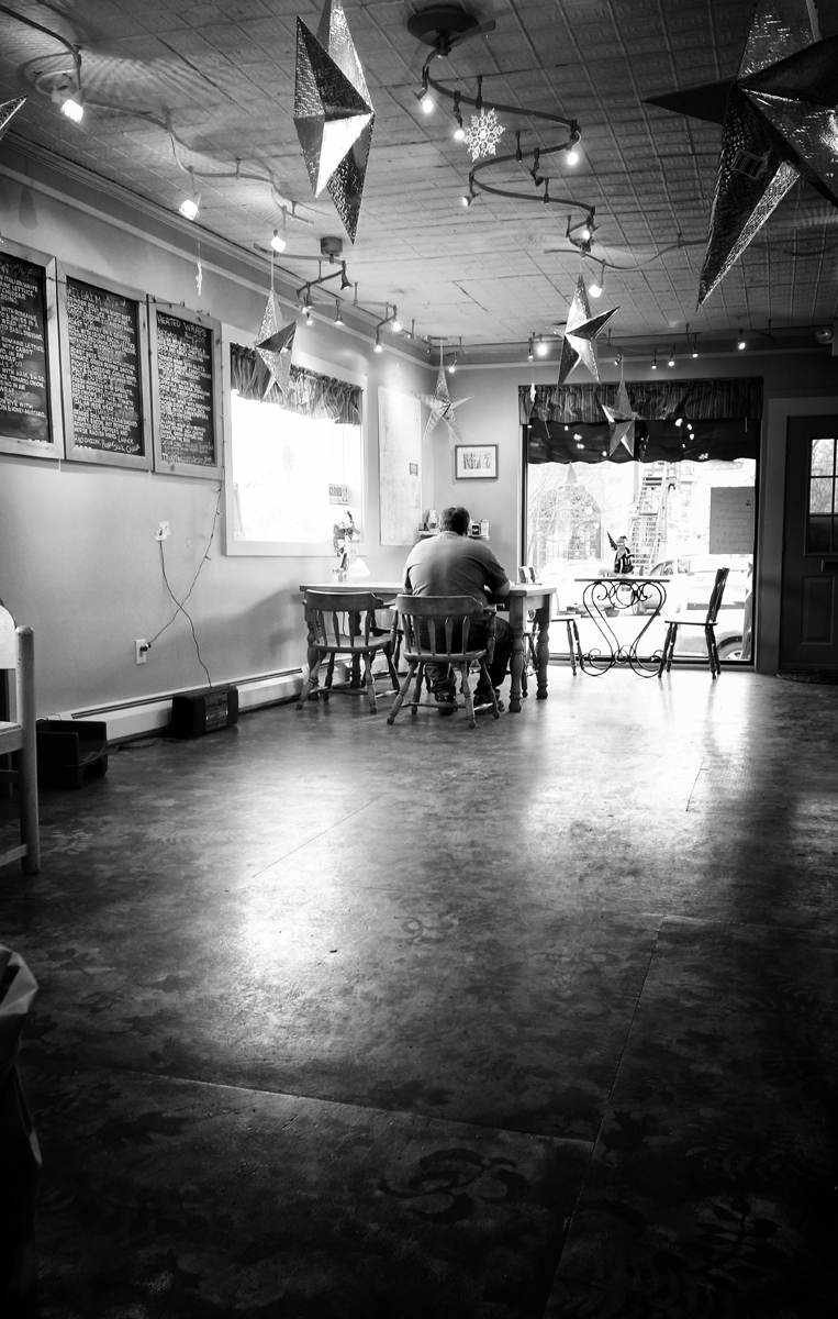 solitary man, lonely, eating alone, empty cafe, christmas decorations, VT