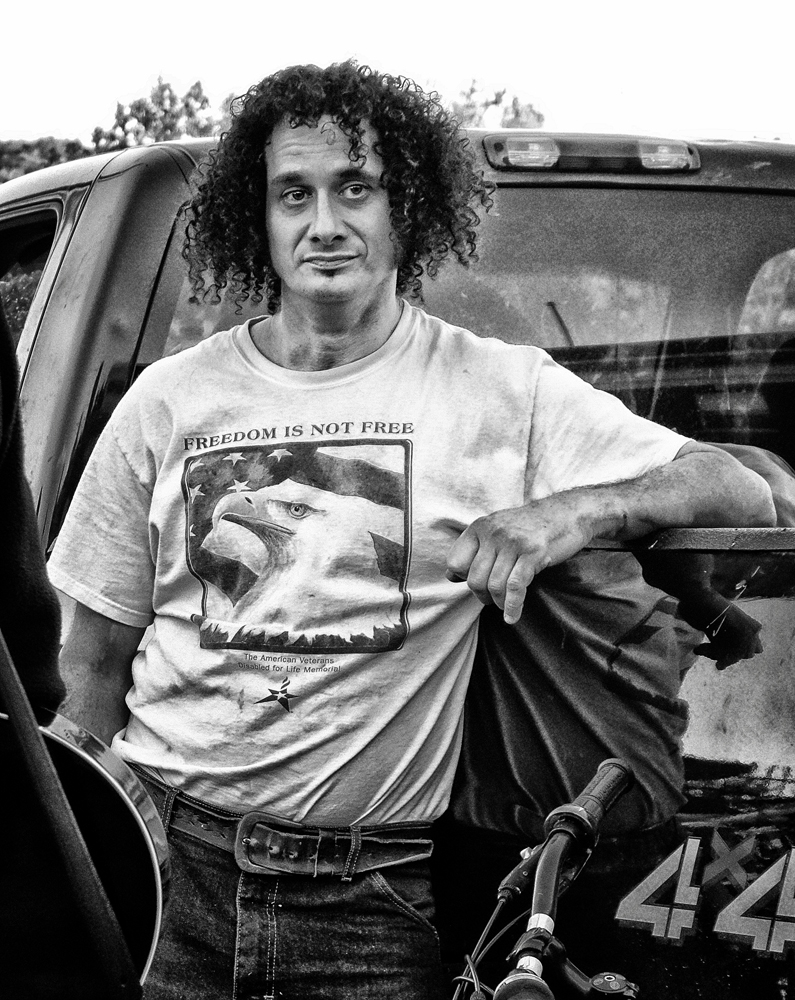 Street photography, Freedom is not free, logo, man in T-shirt, White River Junction, VT